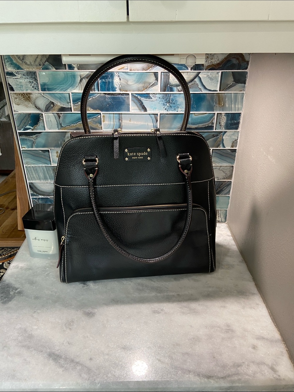 kate spade black pebbled leather satchel with gold-tone logo